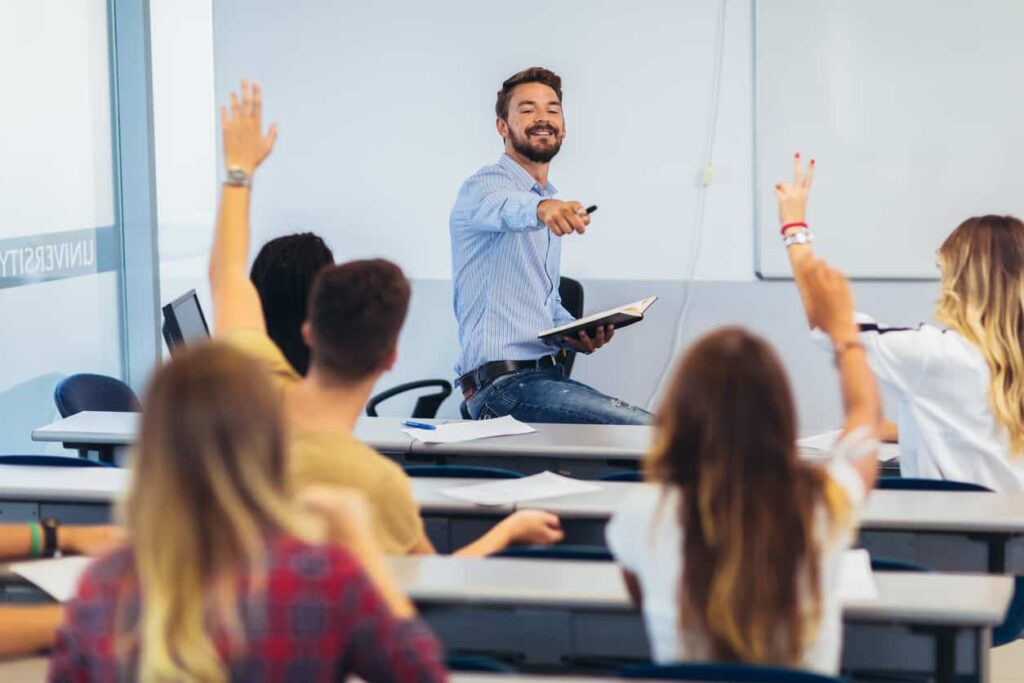 Student practicing spoken English confidently in a classroom